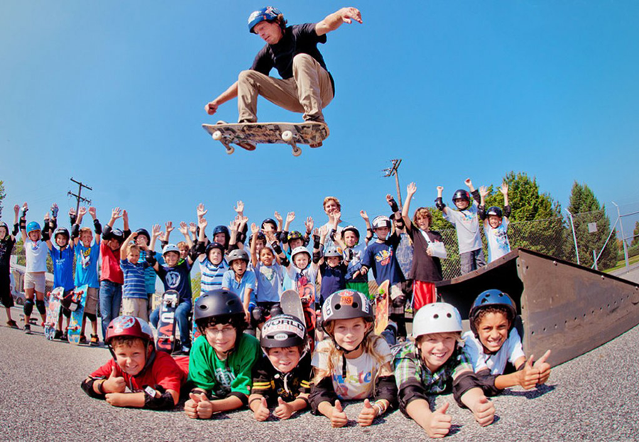 Gary Smith airing over kids at the summer skate camp he runs through Vu Skateshop